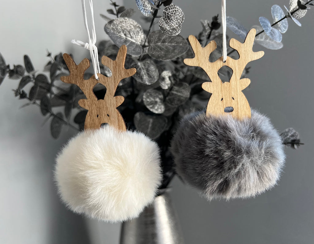 Wooden reindeer decorations with pom poms